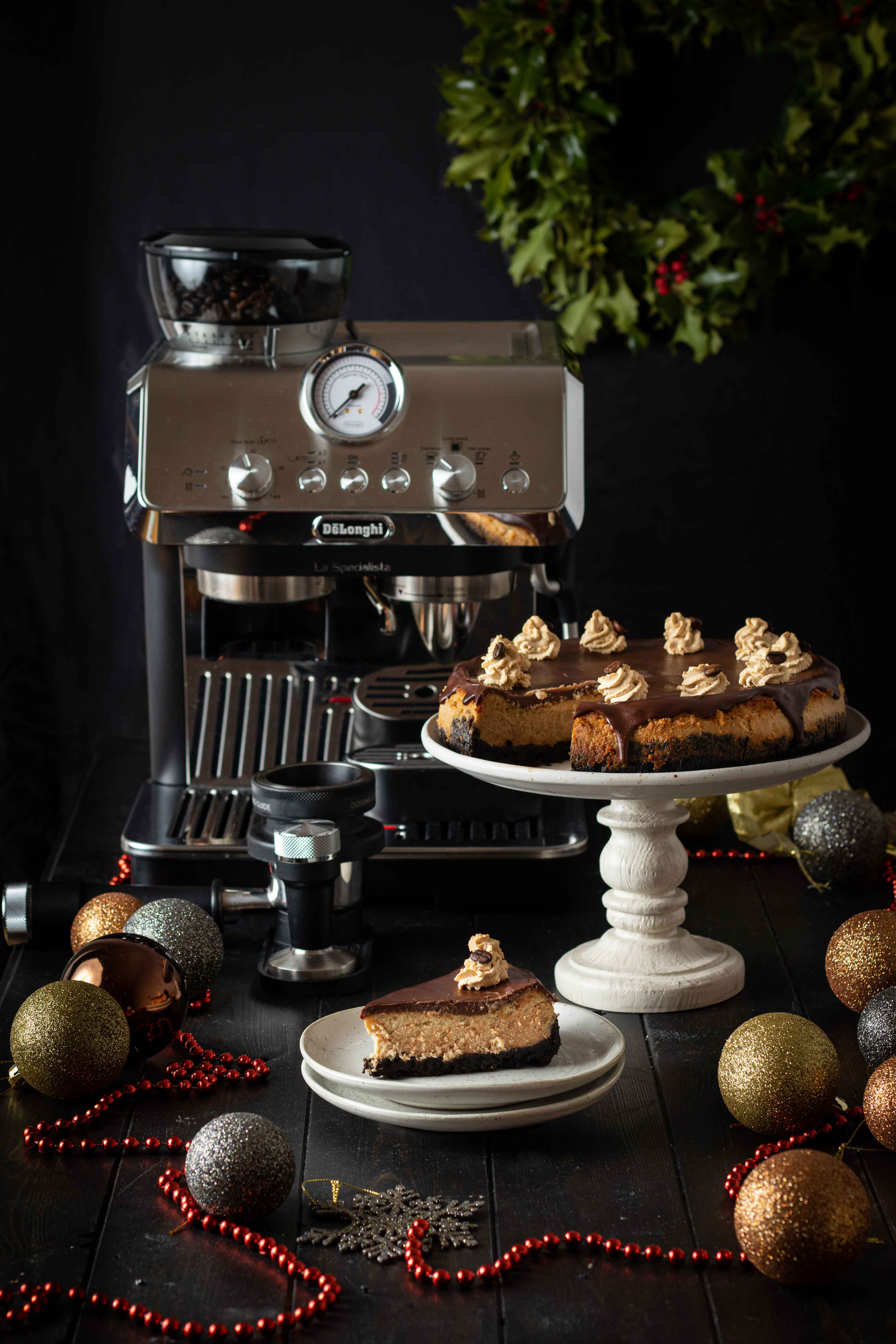 Baked coffee cheesecake with dark chocolate ganache and mocha cream frosting