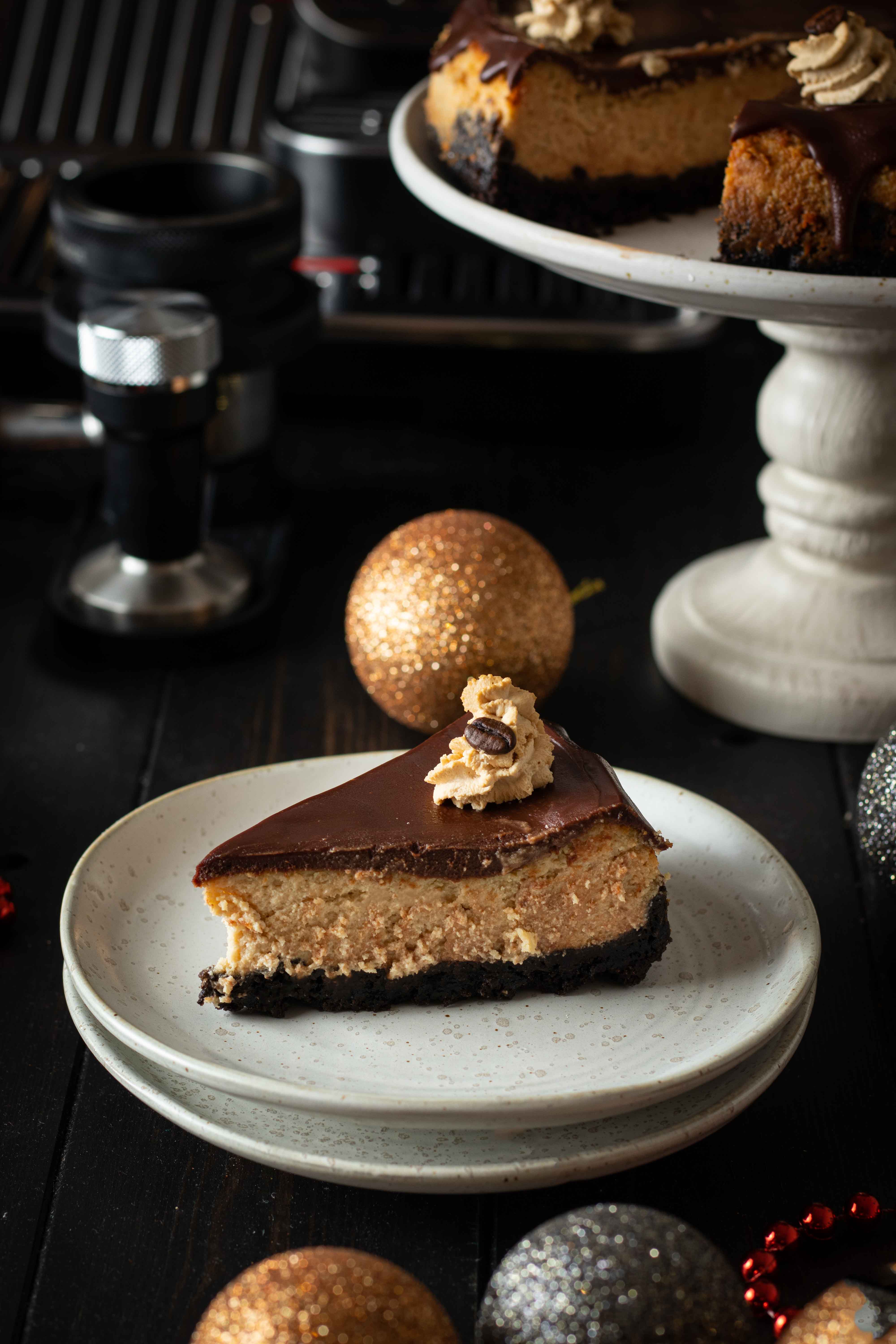 Baked coffee cheesecake with dark chocolate ganache and mocha cream frosting