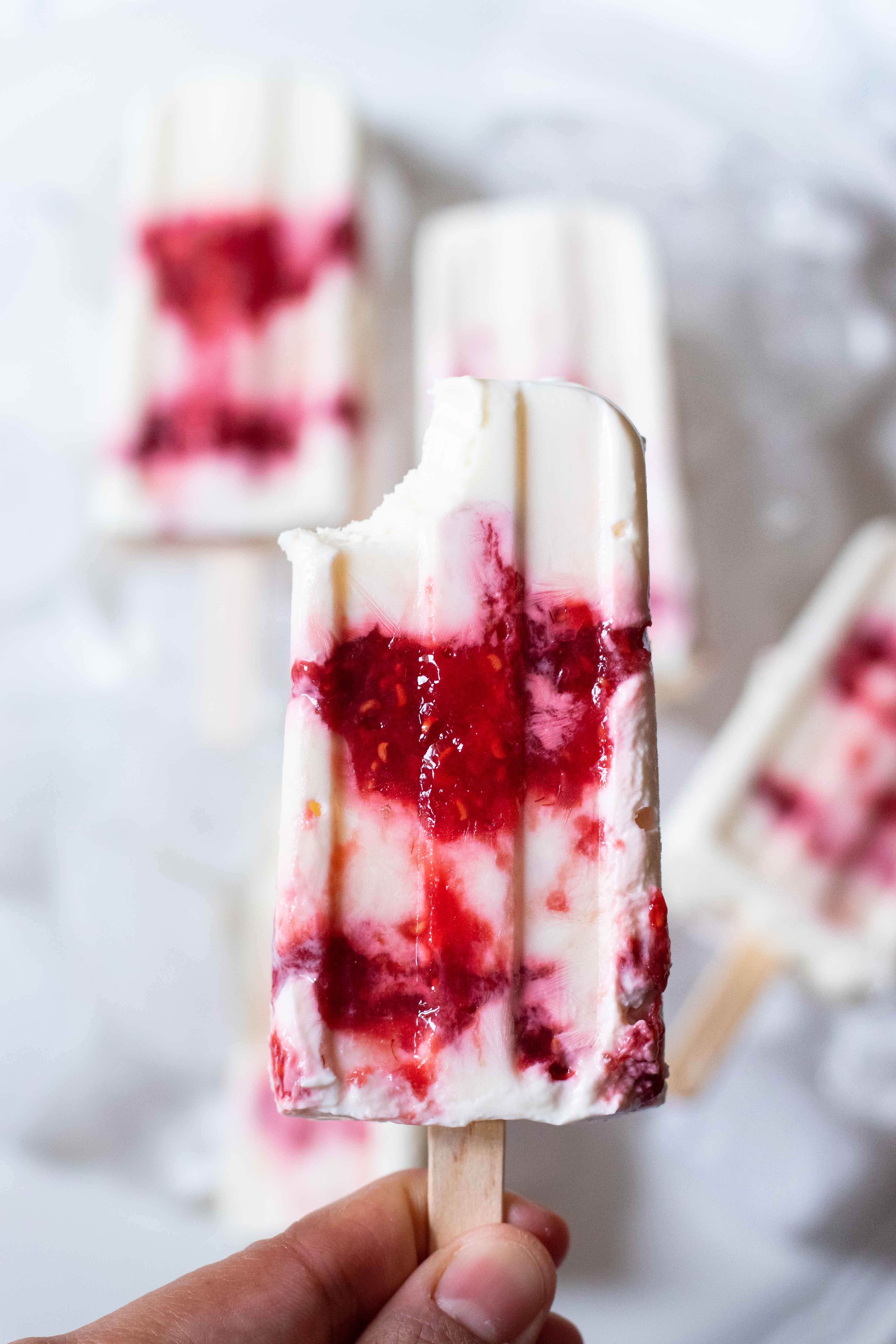 greek yogurt and berry jam popsicles